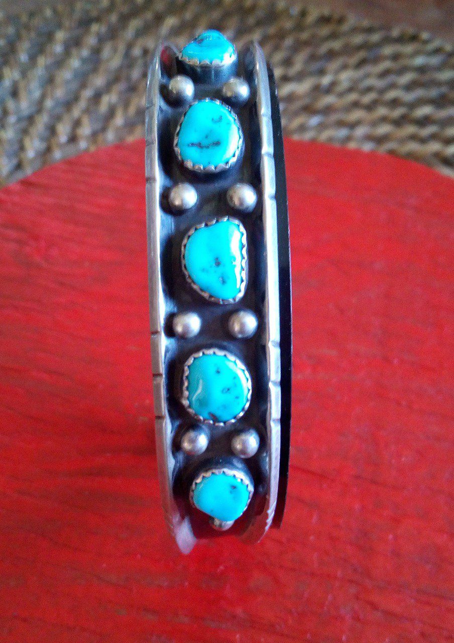 Bracelet foncé + pierres bleu